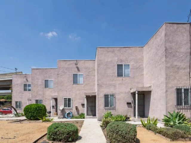 Six two-story townhome-style apartments at 517 W. 117th Street in South Los Angeles